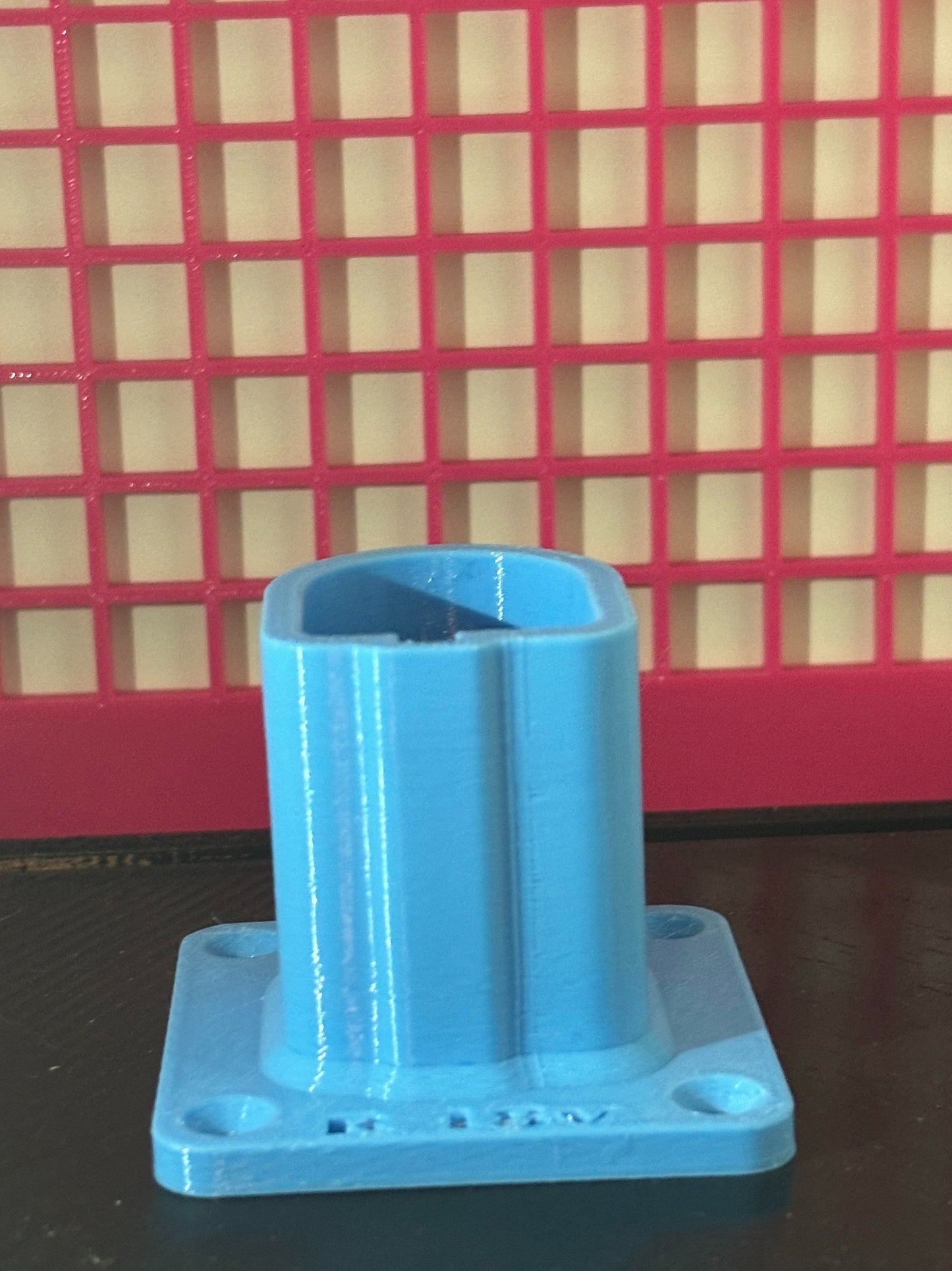 A single sky blue 3D printed battery holder for Ryobi 18v batteries, prominently displayed on a white background.