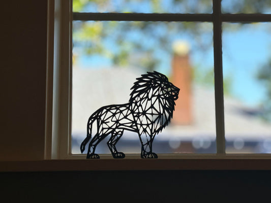 A vibrant sky blue geometric lion figure with a modern and angular design, beautifully displayed on a white surface, perfect as a unique gift.